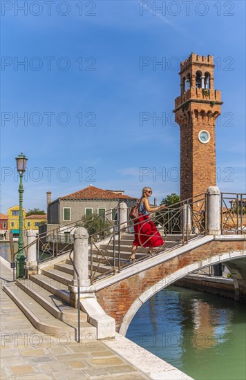 Young woman at a canal