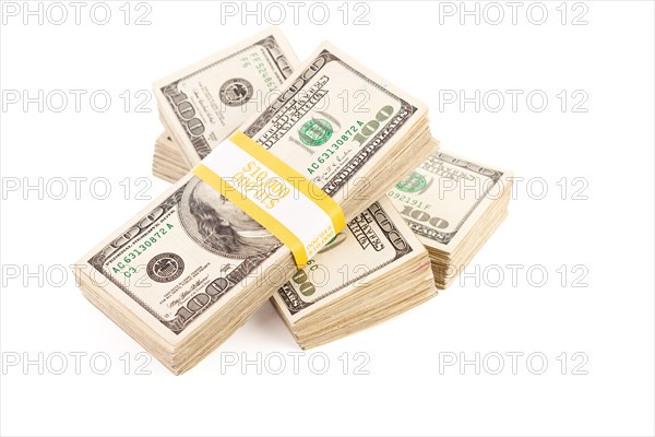 Stacks of ten thousand dollar piles of one hundred dollar bills isolated on a white background