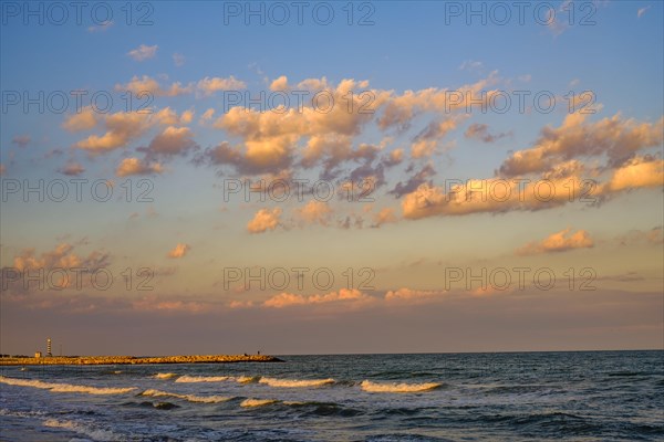 The Adriatic Sea with light waves in the evening light