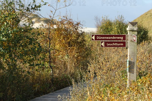 Signpost at the wooden plank path at Kniepsand