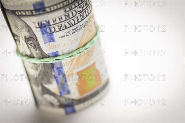 Abstract roll of newly designed U.S. one hundred dollar bills