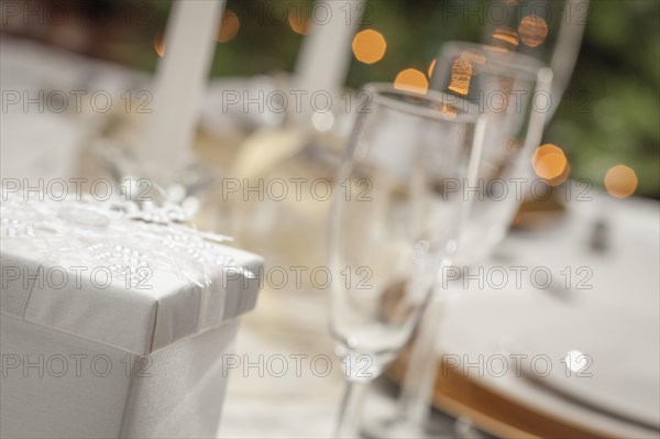 Beautiful christmas gift with place setting abstract at table
