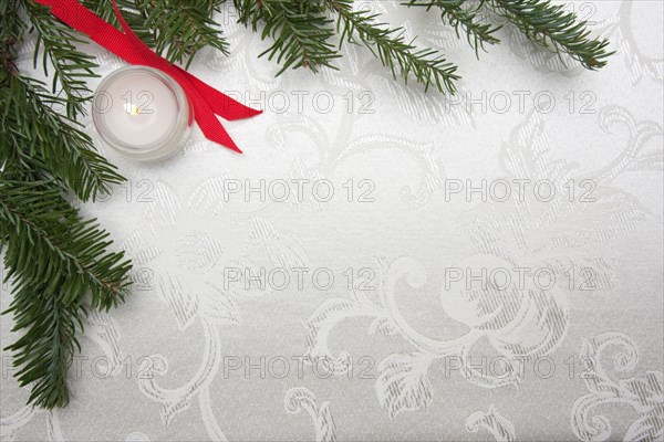 Silk christmas background with candle