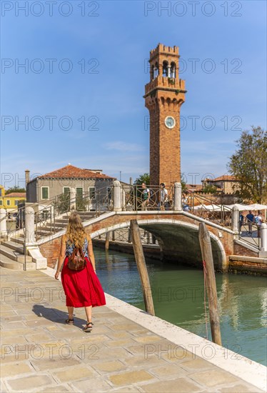 Young woman at a canal