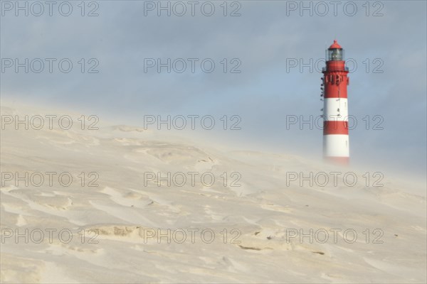 Lighthouse in dune landscape