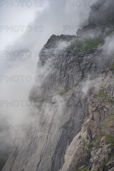 View from Helvetestinden to rock face of Mount Storskiva