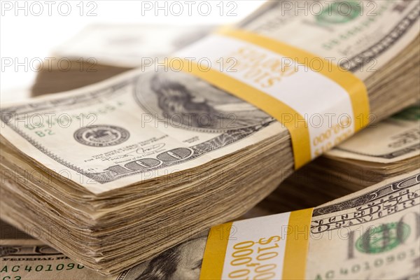 Stacks of ten thousand dollar piles of one hundred dollar bills
