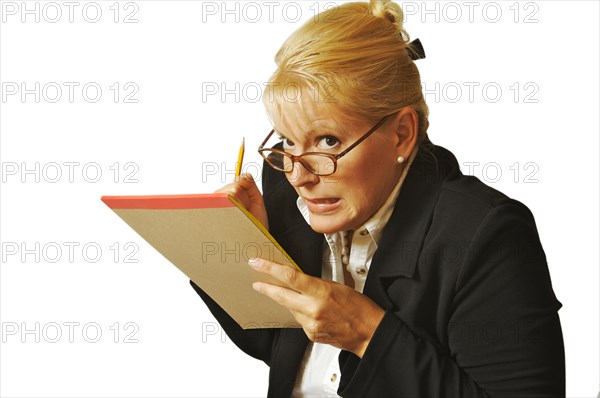 Female erases mistake on her notepad on a white background