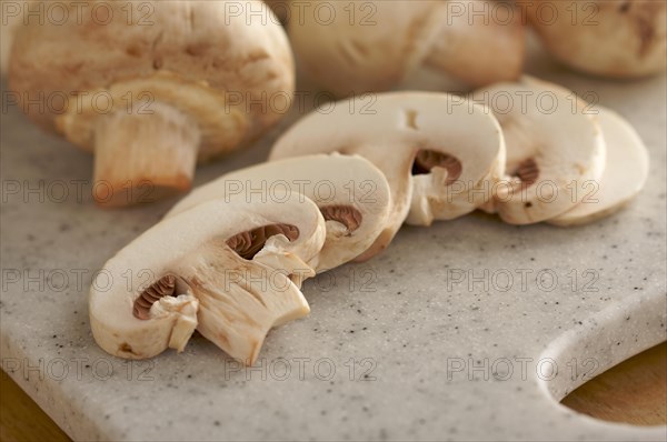 Delicious fresh sliced mushrooms on a cutting board