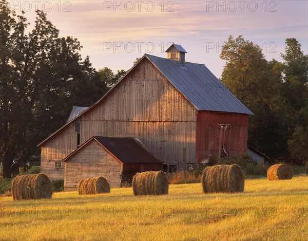 Barn and round hay bales in North Hero
