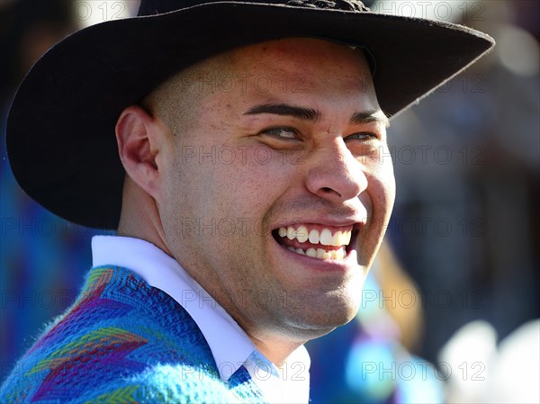 Portrait of a man in traditional traditional costume during a parade on the eve of Inti Raymi