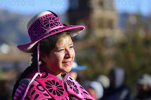 Portrait of an indigenous woman in traditional traditional costume during the parade on the eve of Inti Raymi