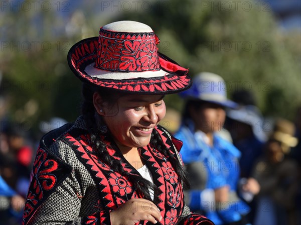 Portrait of an indigenous woman in traditional traditional costume during the parade on the eve of Inti Raymi