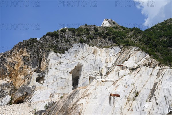 Terraced rock face in open pit carrara marble mines or quarries