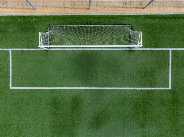 Aerial view of goal on soccer pitch covered with artificial grass in Altea La Vella