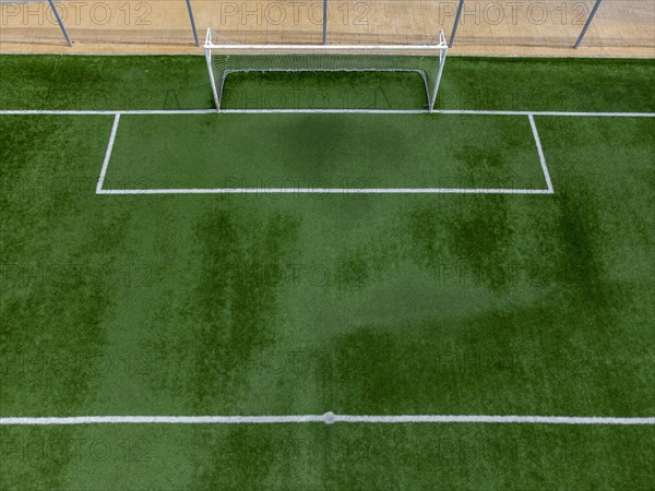 Aerial view of goal on soccer pitch covered with artificial grass in Altea La Vella