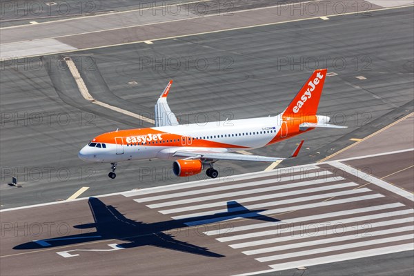 An Easyjet Airbus A320 with the registration G-EZRM lands at Gibraltar Airport