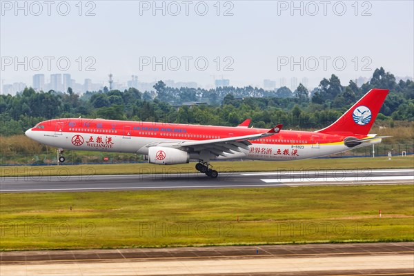 An Airbus A330-300 aircraft of Sichuan Airlines with registration number B-5923 and special livery Wuliangye at Chengdu Airport