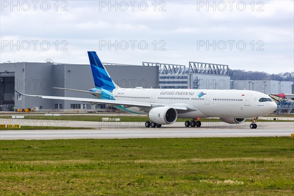 An Airbus A330-900neo of Garuda Indonesia with the registration F-WWCD at Hamburg Finkenwerder Airport