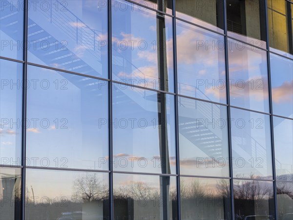 Detail glass front Paul-Loebe-Haus with stairs and reflection sky