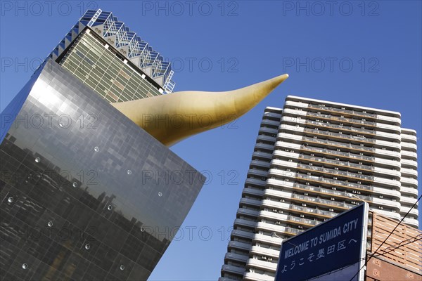 Asahi Breweries headquarters building with the Asahi Flame by french designer Philippe Starck on the east bank of the Sumida River in Sumida district