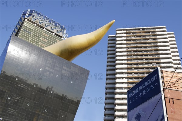 Asahi Breweries headquarters building with the Asahi Flame by french designer Philippe Starck on the east bank of the Sumida River in Sumida district