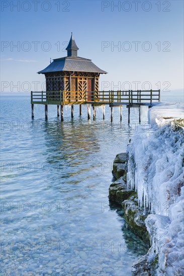 Iced wooden bathhouse on Lake Neuchatel in Gorgier