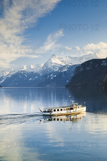 View from Brunnen on a boat on the Lake of Uri in front of the mountain scenery of the Alps of Uri