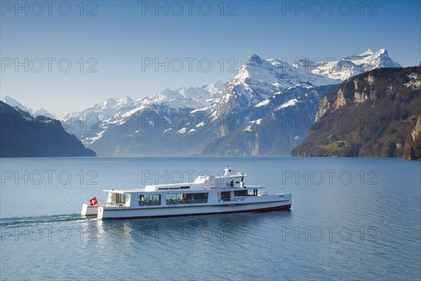 View from Brunnen on a boat on the Lake of Uri in front of the mountain scenery of the Alps of Uri