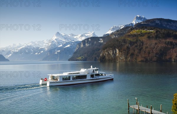 View from Brunnen on a boat on the Lake of Uri in front of the mountain scenery of the Alps of Uri