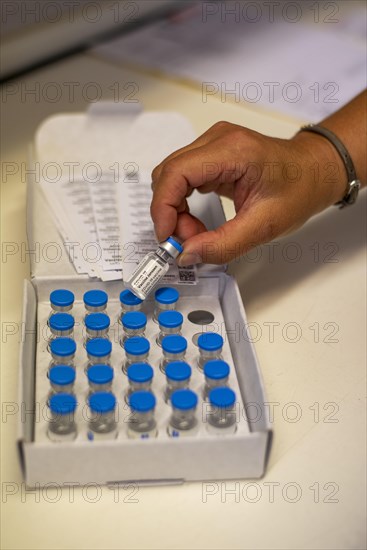 Pharmacist holding Johnson and Johnson vaccine