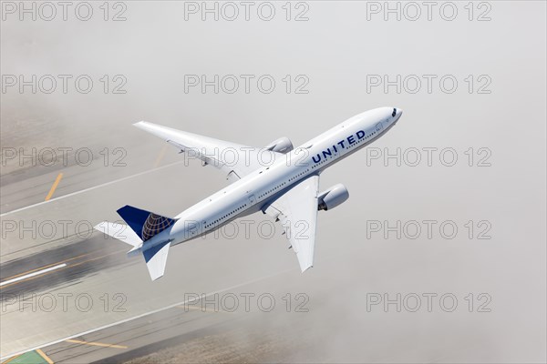 A United Airlines Boeing 777-200 with the registration N775UA takes off from Los Angeles Airport