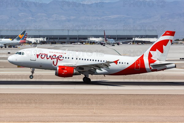 An Air Canada Rouge Airbus A319 aircraft with registration C-GBIN lands at Las Vegas airport