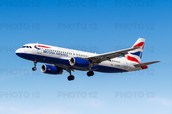 A British Airways Airbus A320 with the registration G-EUUD lands at London Heathrow Airport
