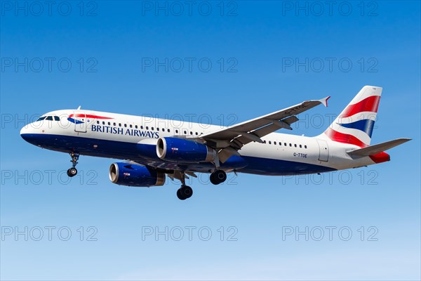 A British Airways Airbus A320 with the registration G-TTOE lands at London Heathrow Airport