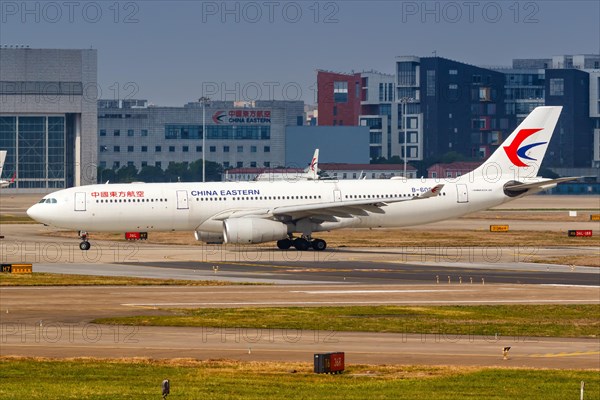 An Airbus A330-300 of China Eastern Airlines with registration number B-6085 at Shanghai Hongqiao Airport