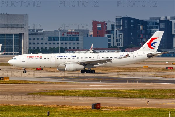 An Airbus A330-300 of China Eastern Airlines with registration number B-6085 at Shanghai Hongqiao Airport