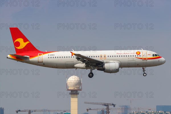 A Tianjin Airlines Airbus A320 with registration number B-6903 at Shanghai Hongqiao Airport