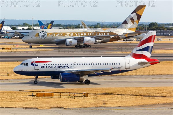 A British Airways Airbus A319 with the registration G-EUPO and an Etihad Airbus A380 at London Heathrow Airport
