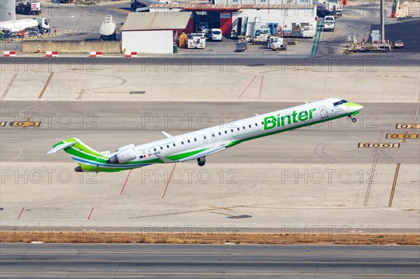 A Bombardier CRJ-1000 aircraft of Binter with registration 9H-MOX takes off from Palma de Majorca Airport