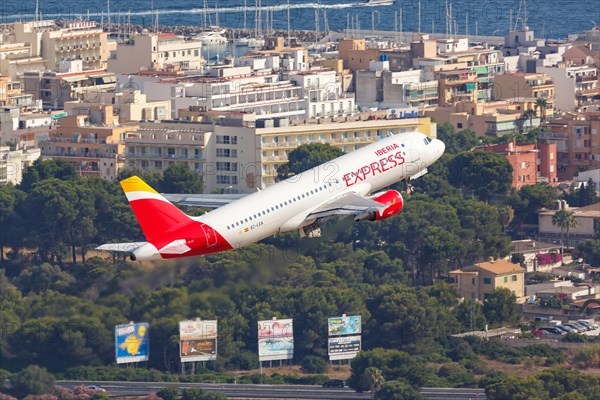 An Iberia Express Airbus A320 with the registration EC-LEA takes off from Palma de Majorca Airport