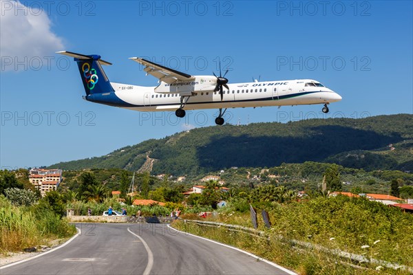 A Bombardier DHC-8-400 aircraft of Olympic Air with registration number SX-OBG at Skiathos Airport