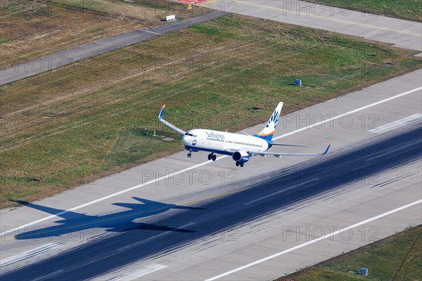 A SunExpress Boeing 737-800 with the registration D-ASXA takes off from Stuttgart Airport