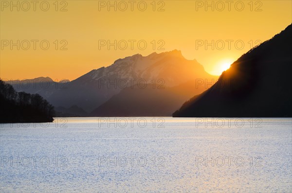 Lake with mountains in the background