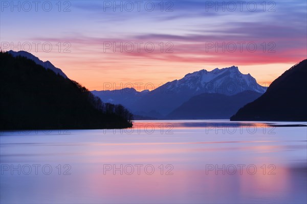 Lake with mountains in the background