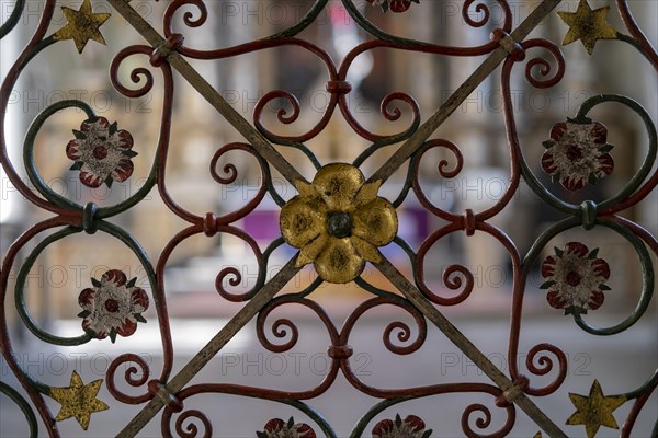 Wrought-iron grille with floral ornamentation in front of the high altar in the abbey church of St. James the Elder