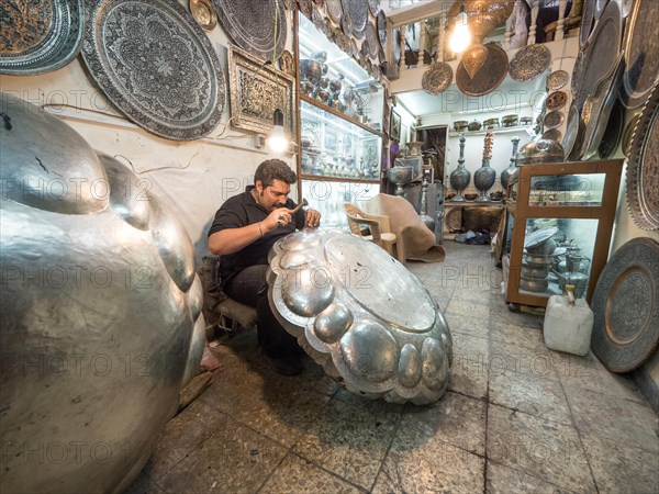 Craftsman with silver work in the bazaar