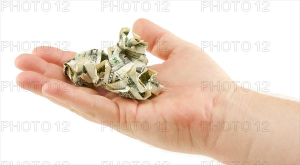 Crumpled dollar bills in palm isolated on a white background