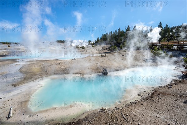 Steaming hot springs with turquoise water