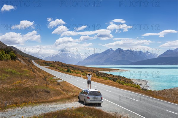 Guy on a car roof